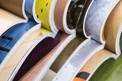 Stack of open magazines. journal, media, print
** Note: Shallow depth of field